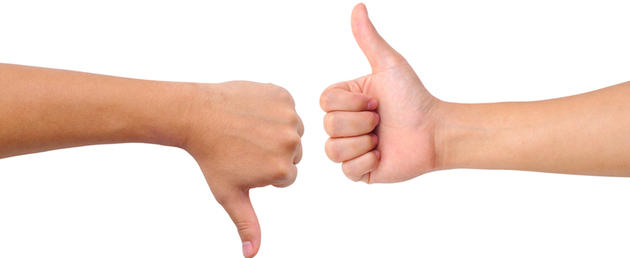 Stock photo of a thumb up and a thumb down