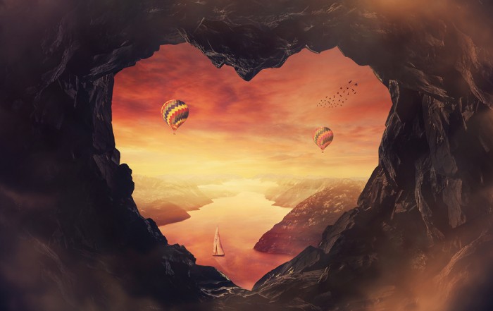 heart shaped cave overlooking a river with mountains, boats and balloons: Bigstockphoto.com / 1STunningArt